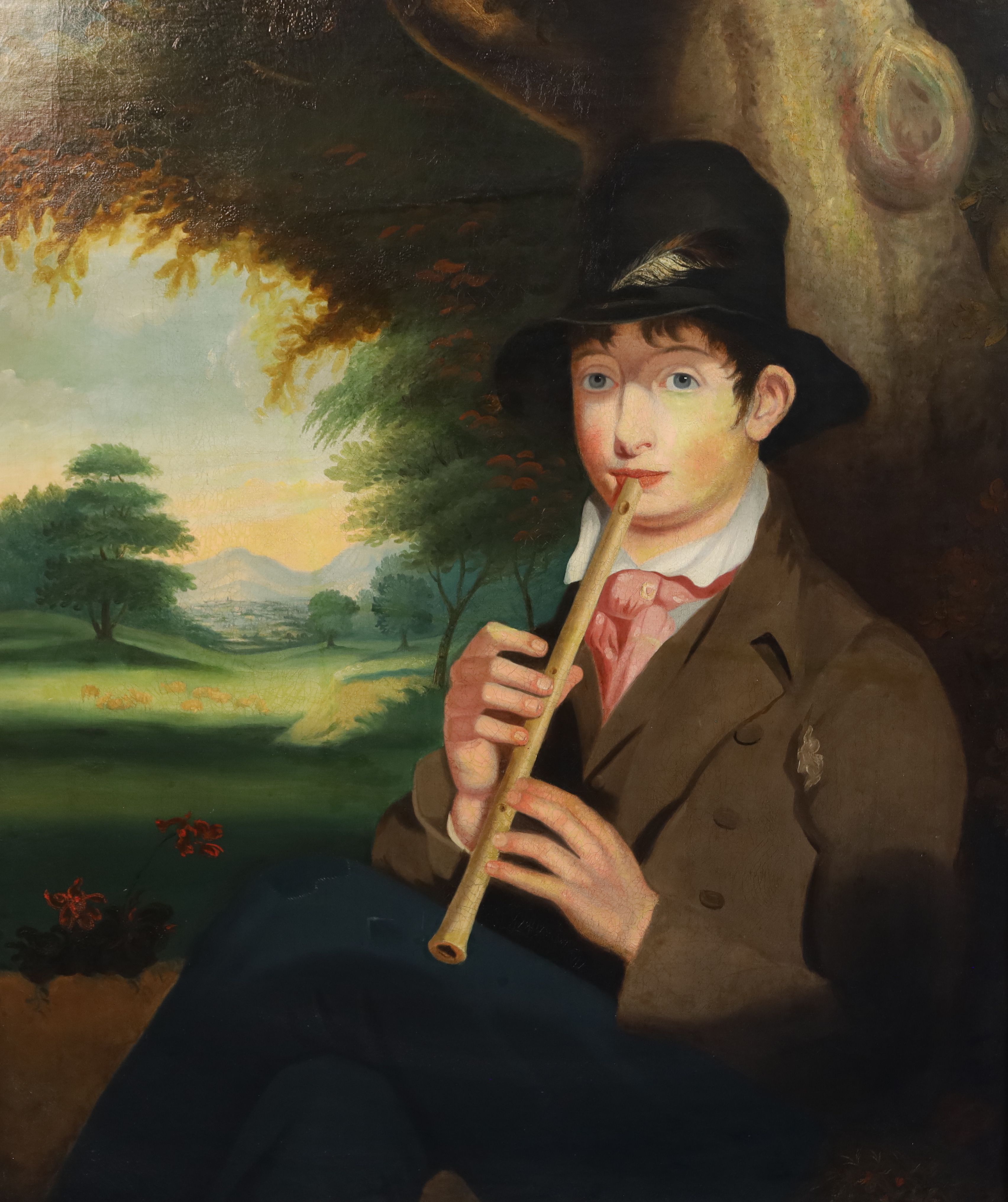 English School c.1840 Naive portrait of a pipe player seated in a pastoral landscape 35. x 28in.